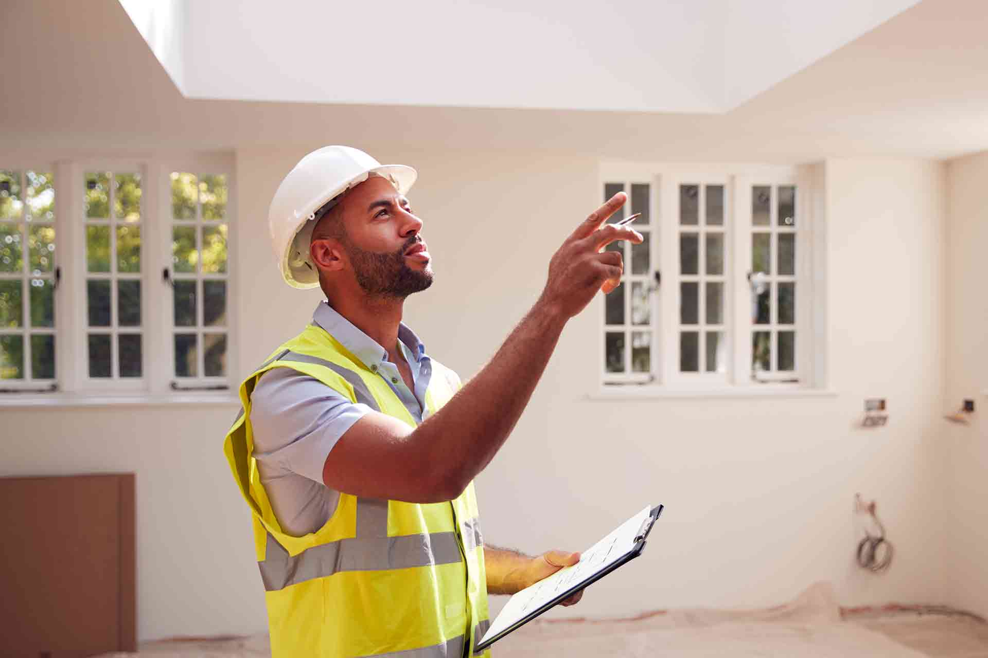 Third Party Wall Surveyors Chippenham reviewing plans between two parties during a dispute